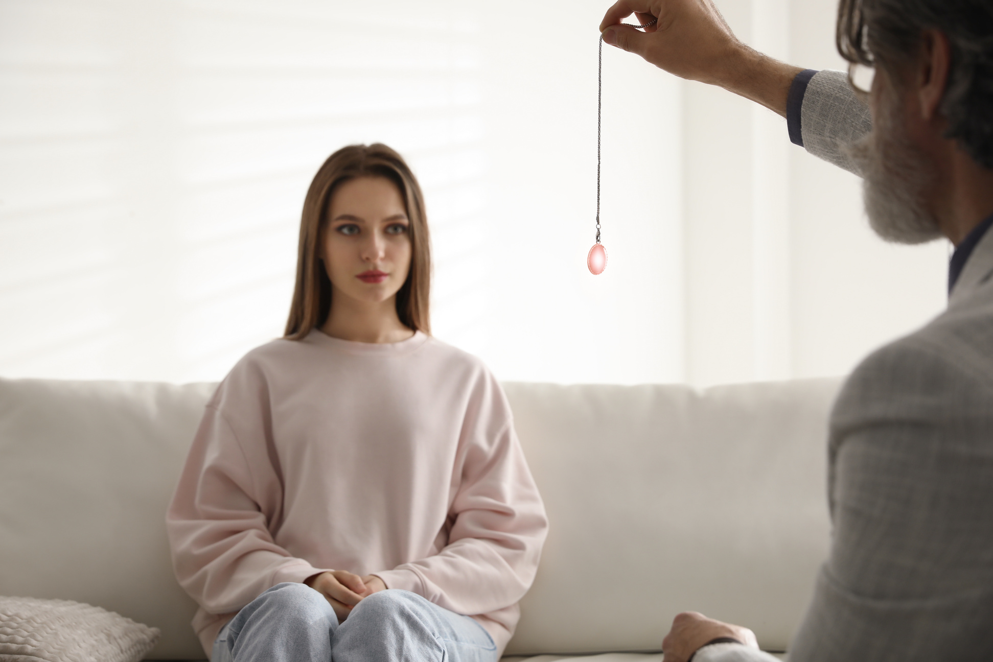 Psychotherapist Using Pendulum during Hypnotherapy   Session in